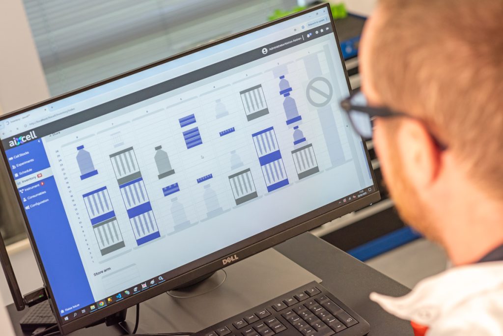 Over-the-shoulder view of consumables inventory graphic in autonomous cell culture system UI.